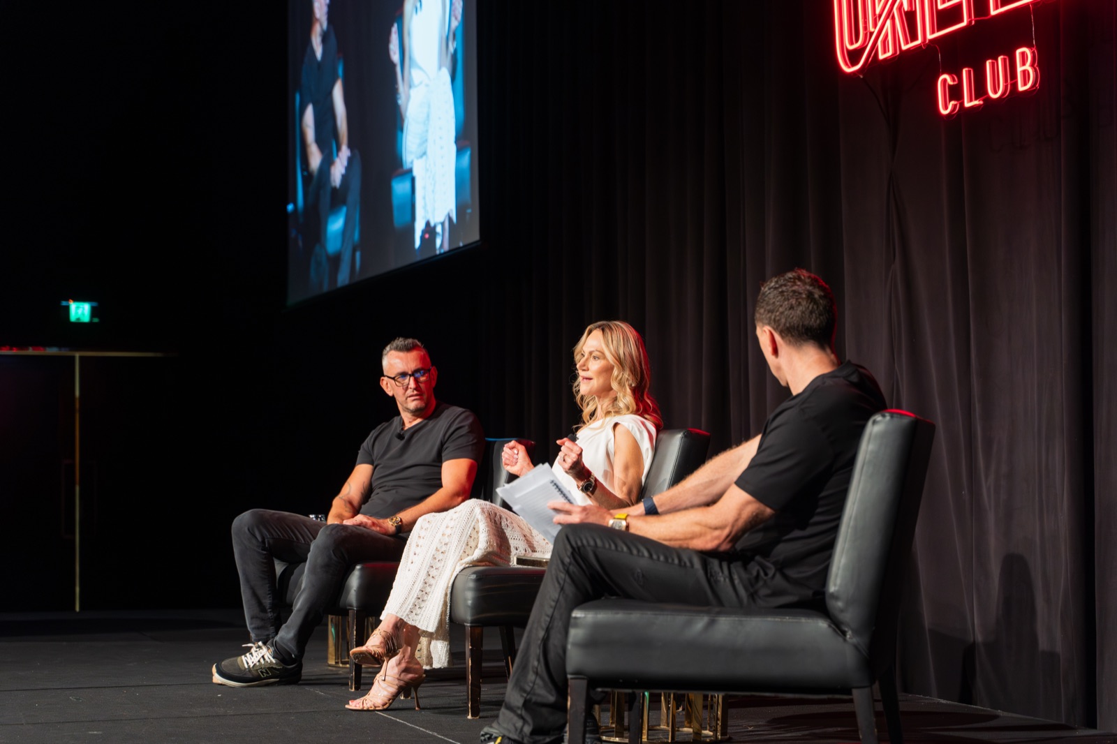 Simon and Emil in a main-stage conversation under the One Life Club sign