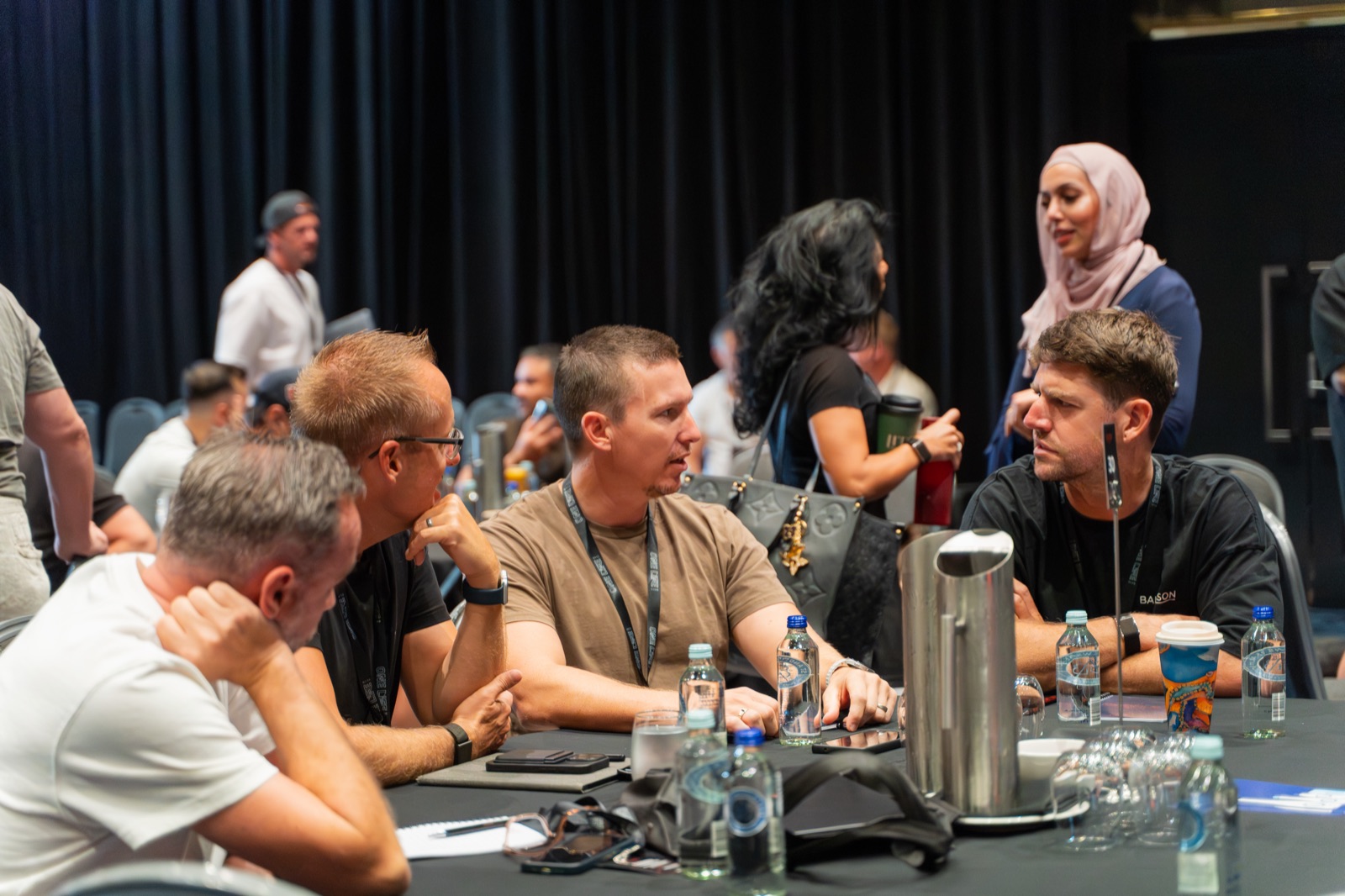 Members leaned in around a summit roundtable